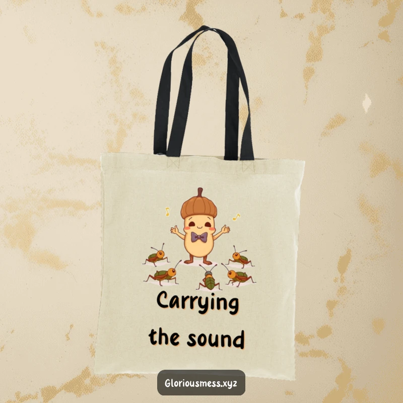 Funny tote bag featuring a mischievous acorn in a bowtie conducting crickets, a humorous and practical accessory for nature lovers.